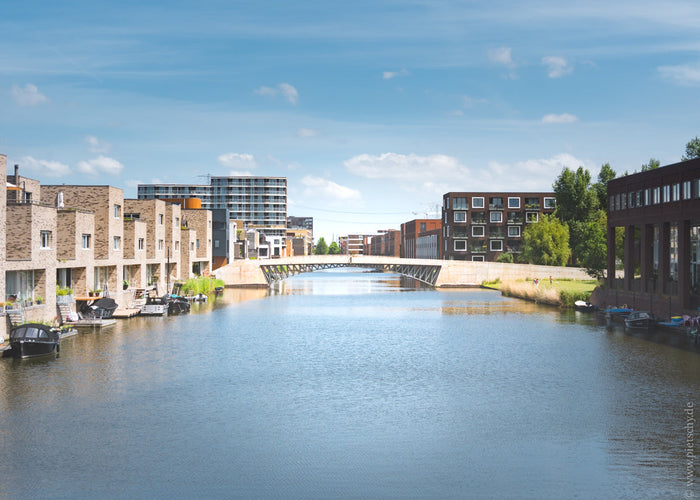 Amsterdam IJburg, IJburg Amsterdam modern architecture, Amsterdam IJburg canal view, contemporary Amsterdam neighborhood, modern housing Amsterdam waterfront, IJburg bridge Amsterdam, urban development Netherlands, Amsterdam residential architecture moder