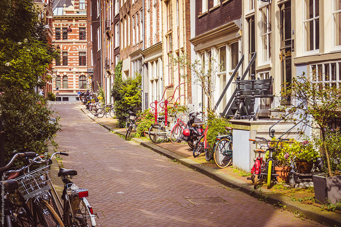 Summer in Amsterdam streets, Amsterdam street photography, Amsterdam summer street, Amsterdam bicycles, Dutch city life, Amsterdam neighborhood photography, historic Amsterdam streets, charming Amsterdam street, Amsterdam architecture photography, local l