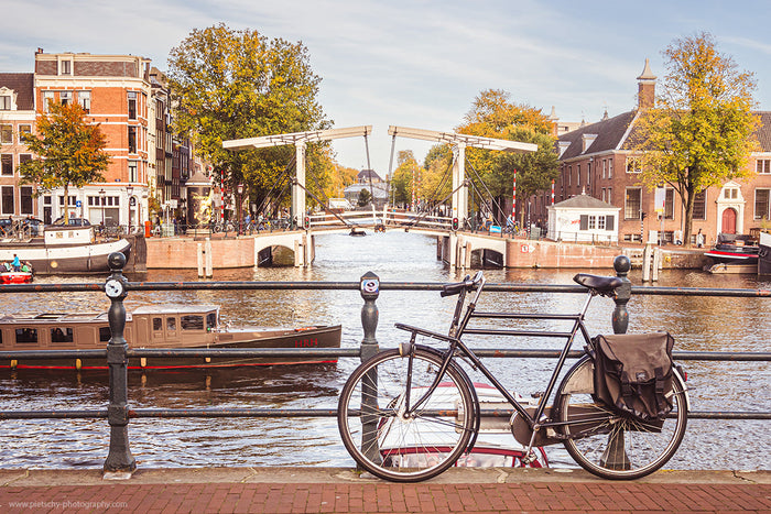 Walter Süskindbrug Amsterdam, Amstel river bridge, Stefanie Pietschmann Photographer, Dutch canal cityscape, Pietschy Photography, bicycle and bridge photography, classic Amsterdam atmosphere, freedom in everyday moments, sustainable wall art, storytellin