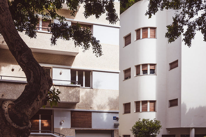 Bauhaus architecture in Tel Aviv, Rothschild Boulevard Bauhaus, Stefanie Pietschmann Photographer, White City modernism, Pietschy Photography, curved Bauhaus facade, Tel Aviv architectural heritage, minimalist urban architecture, sustainable wall art, sto