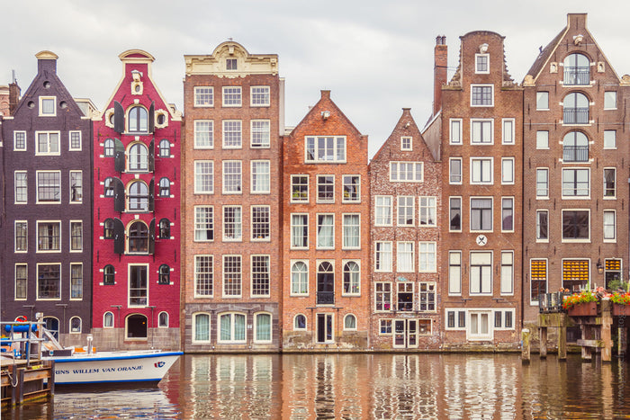 Dancing Houses of Amsterdam, Damrak waterfront architecture, Stefanie Pietschmann Photographer, colorful canal houses Amsterdam, Pietschy Photography, historic Dutch facades, Amsterdam reflections photography, heritage cityscape Netherlands, sustainable w