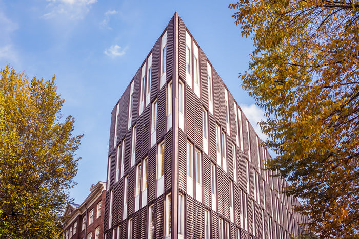 modern architecture in Amsterdam, contemporary architecture Amsterdam, modern building Amsterdam, Amsterdam architecture photography, geometric architecture Amsterdam, innovative architecture Netherlands, urban design Amsterdam, modern facade design, arch