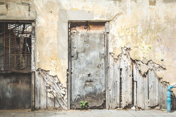 urban decay in Tel Aviv Shapira, abandoned building Tel Aviv, Shapira neighborhood photography, weathered wall texture Israel, urban textures Tel Aviv, raw architecture Israel, distressed facade Tel Aviv, gritty city photography, authentic Tel Aviv street