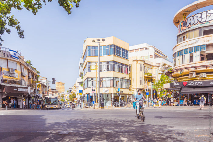 Magen David Square in Tel Aviv, Magen David Square, Tel Aviv city center, Tel Aviv street photography, Shuk HaCarmel area, Carmel Market Tel Aviv, urban life in Tel Aviv, Bauhaus architecture Tel Aviv, Tel Aviv intersection, cycling in Tel Aviv, White Cit