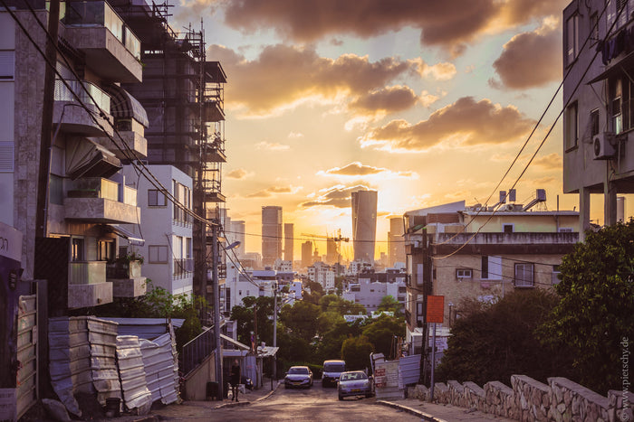 Tel Aviv sunset skyline, sunset over Tel Aviv city, Tel Aviv urban landscape golden hour, Israel city sunset photography, Tel Aviv architecture street view, modern skyline Tel Aviv sunset, warm light cityscape Israel, Tel Aviv evening atmosphere, Mediterr