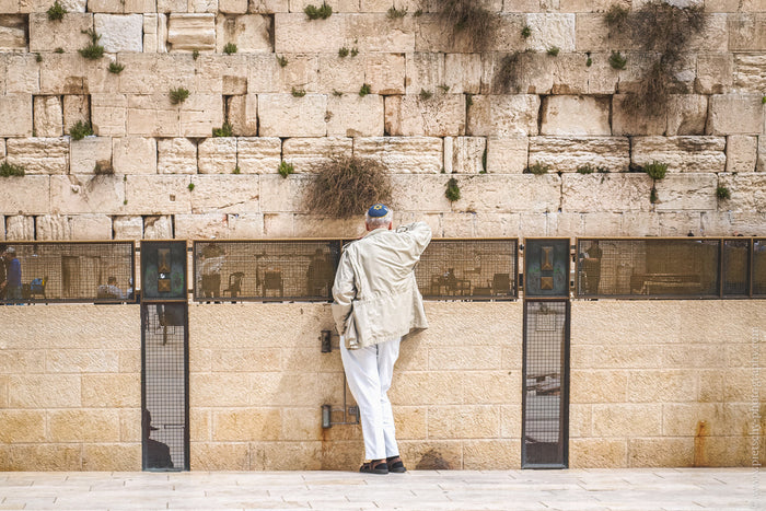 Western Wall in Jerusalem, Kotel prayer moment, Stefanie Pietschmann Photographer, sacred site Israel, Pietschy Photography, Jerusalem spiritual photography, ancient stone wall, quiet reflection Jerusalem, sustainable wall art, storytelling photography