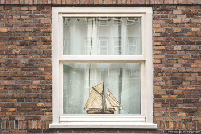 Amsterdam brick wall architecture, Amsterdam window photography, Dutch brick facade, Amsterdam architecture detail, minimalist architecture photography, traditional Dutch architecture, Amsterdam building facade, brick wall texture photography, Amsterdam u