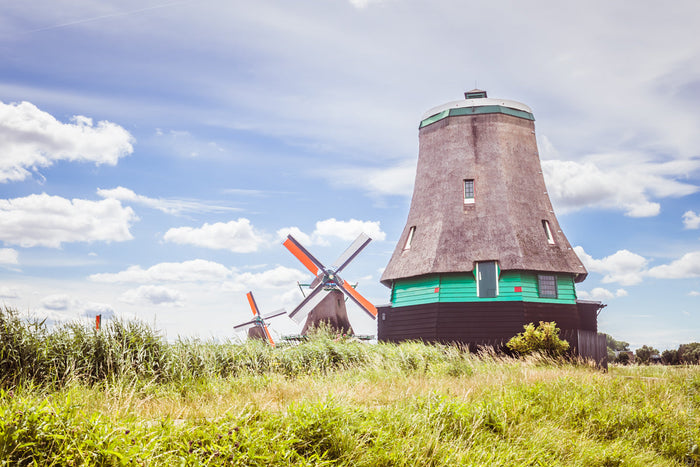 Zaanse Schans windmills Netherlands, Dutch windmills landscape, traditional windmills Holland, Zaanse Schans village photography, iconic Netherlands windmills, historic Dutch architecture countryside, windmills near Amsterdam, green wooden houses Netherla