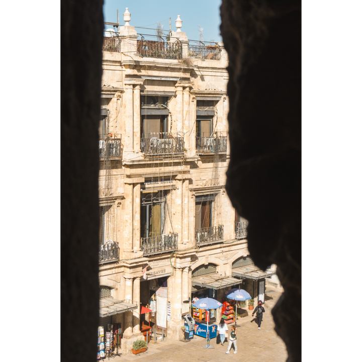This Jerusalem wall art invites you into the timeless calm of the Old City, where golden stone meets shadow and light. Framed by the Tower of David, this view reveals a sunlit corner of Jerusalem, where daily rhythm meets historic architecture.
