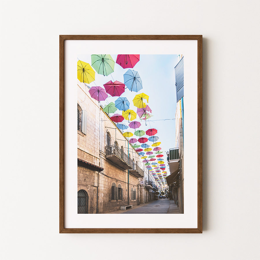 Jerusalem wall art, vibrant cityscape print, colorful umbrella street art, Israel photography poster, fine art Jerusalem print, Middle East decor, architecture photography, travel-inspired art, Jerusalem photo print, modern Judaica wall art, Jerusalem umbrella street, bold wall art, umbrella photography, travel wall decor, Jerusalem fine art print