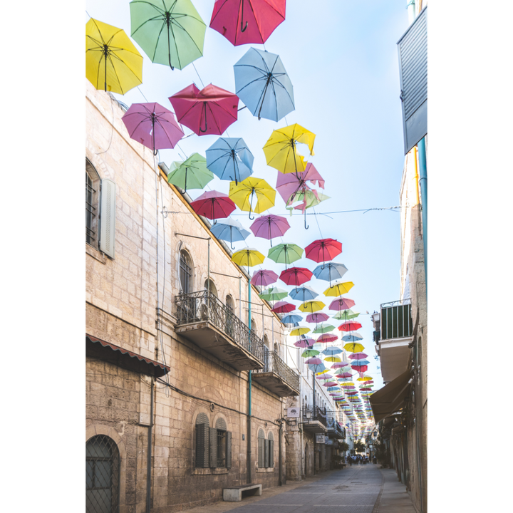 Jerusalem wall art, vibrant cityscape print, colorful umbrella street art, Israel photography poster, fine art Jerusalem print, Middle East decor, architecture photography, travel-inspired art, Jerusalem photo print, modern Judaica wall art, Jerusalem umbrella street, bold wall art, umbrella photography, travel wall decor, Jerusalem fine art print