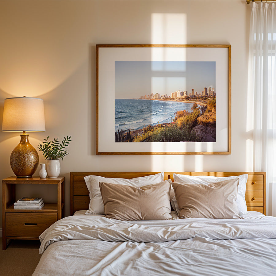 This Tel Aviv beach wall art captures the peaceful yet vibrant Mediterranean coastline where city meets sea, bathed in warm golden light. A fine art print that brings calm and inspiration into any space.

